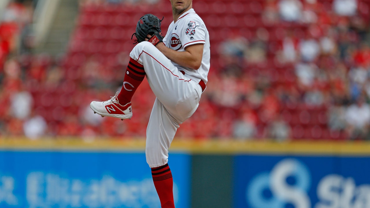 Puig homers again; Reds lose Scooter but beat Brewers 3-0